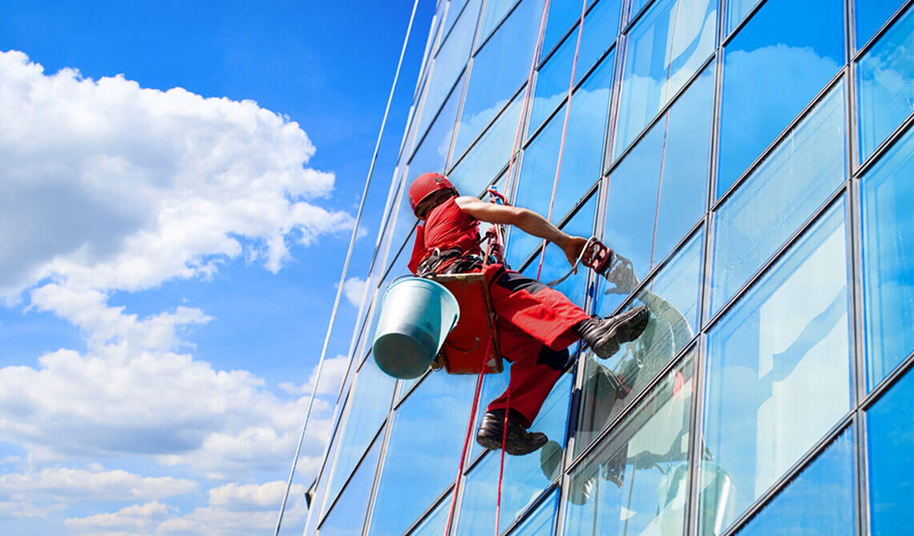 Facade cleaning of a commercial glass and ACP building in Coimbatore