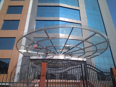 Glass replacement and ACP panel fixing on a building in Coimbatore
